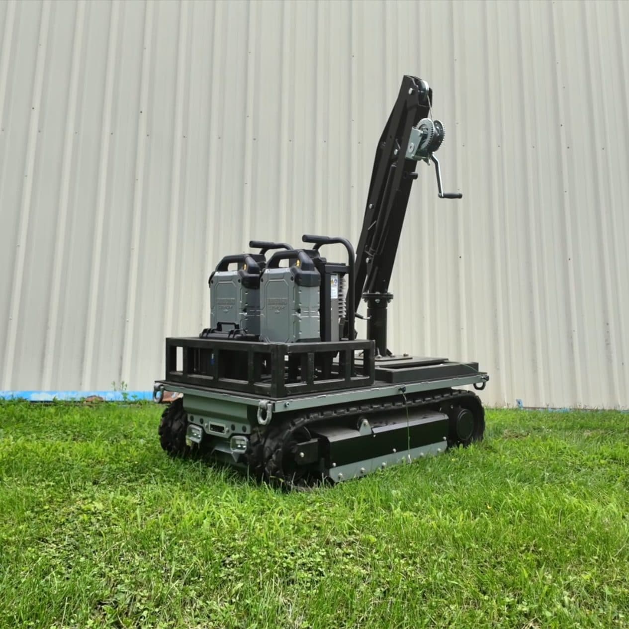 Site Runner fitted with the crane attachment and spare battery packs